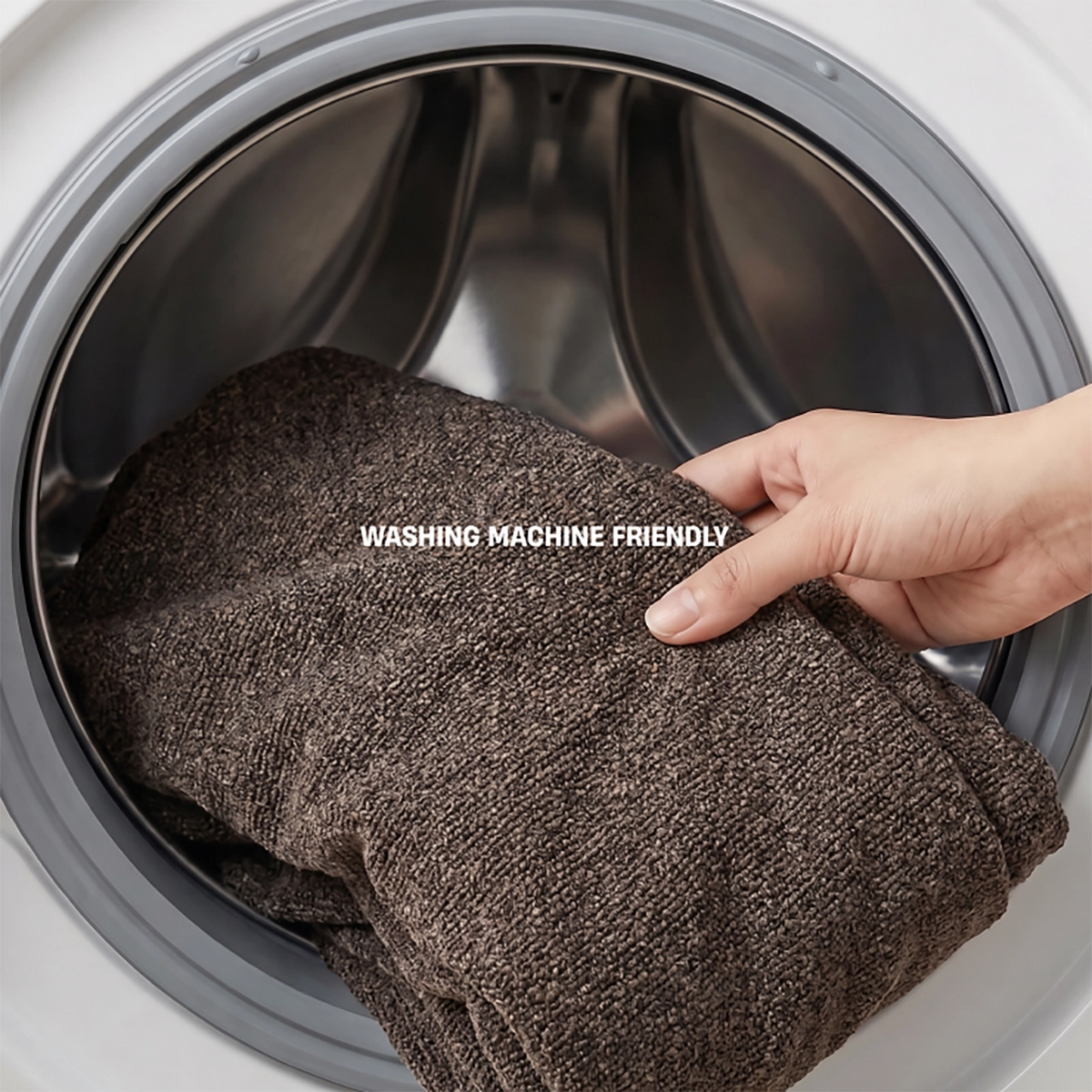 Brown bouclé replacement cover being removed for machine washing.