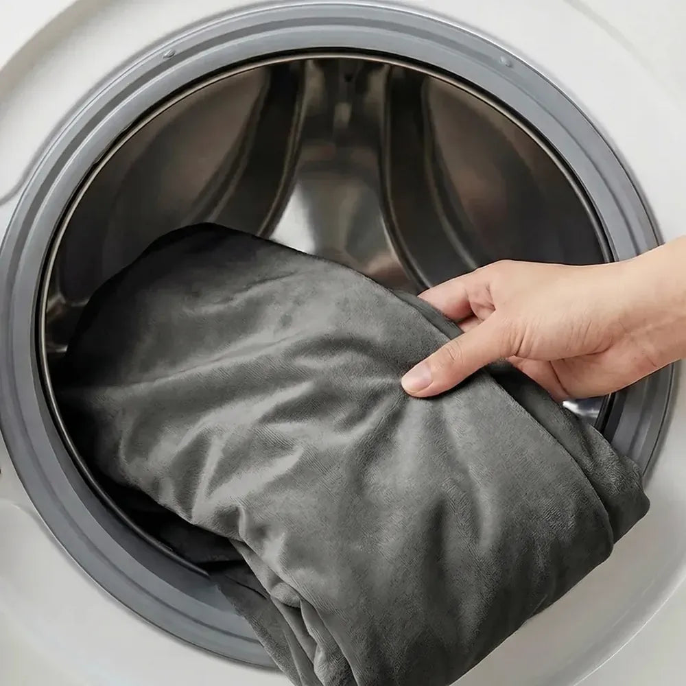 The charcoal cover going into a washing machine